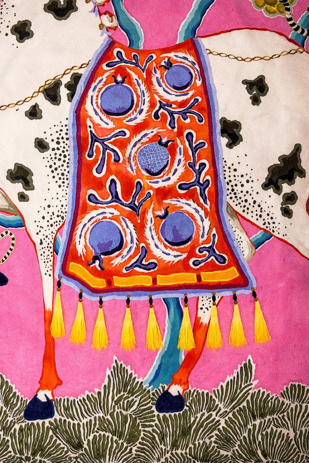 Pink velvet cushion cover with illustrated horse, floral motifs and white corner tassels