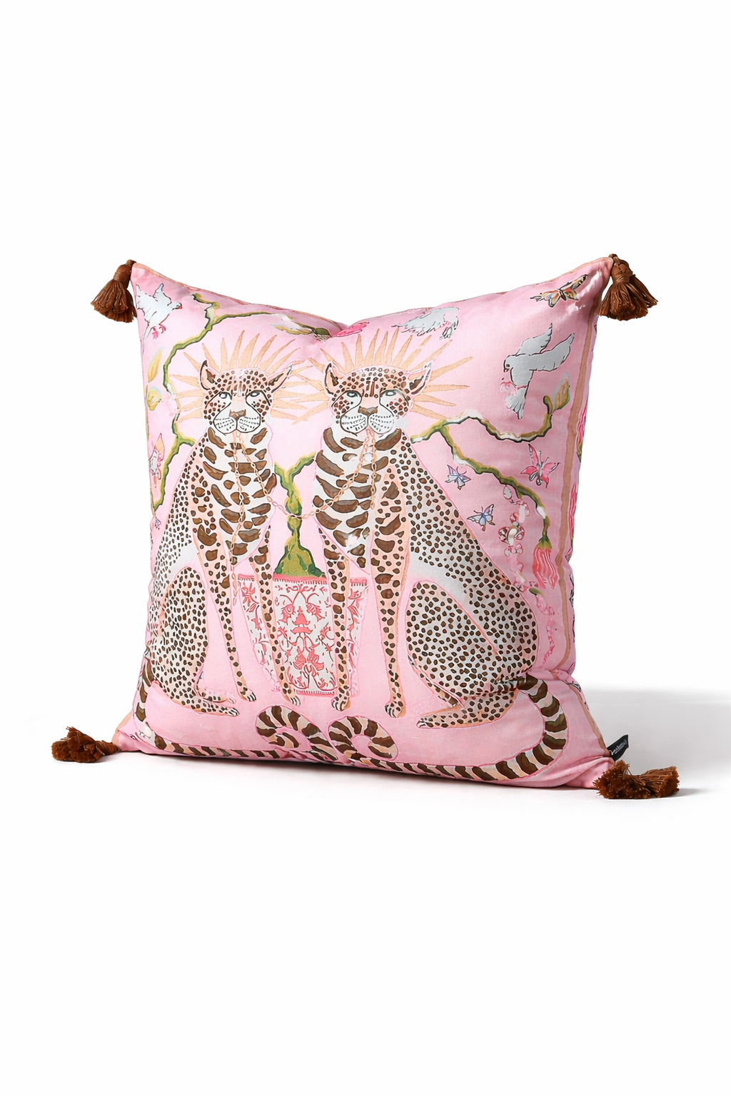 Pink velvet cushion cover with two illustrated cheetahs, sunburst halos, birds, floral branches and brown tassel corners