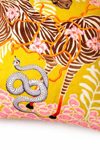 Yellow velvet cushion cover with illustrated zebra, floral branches, snake motif and pink corner tassels