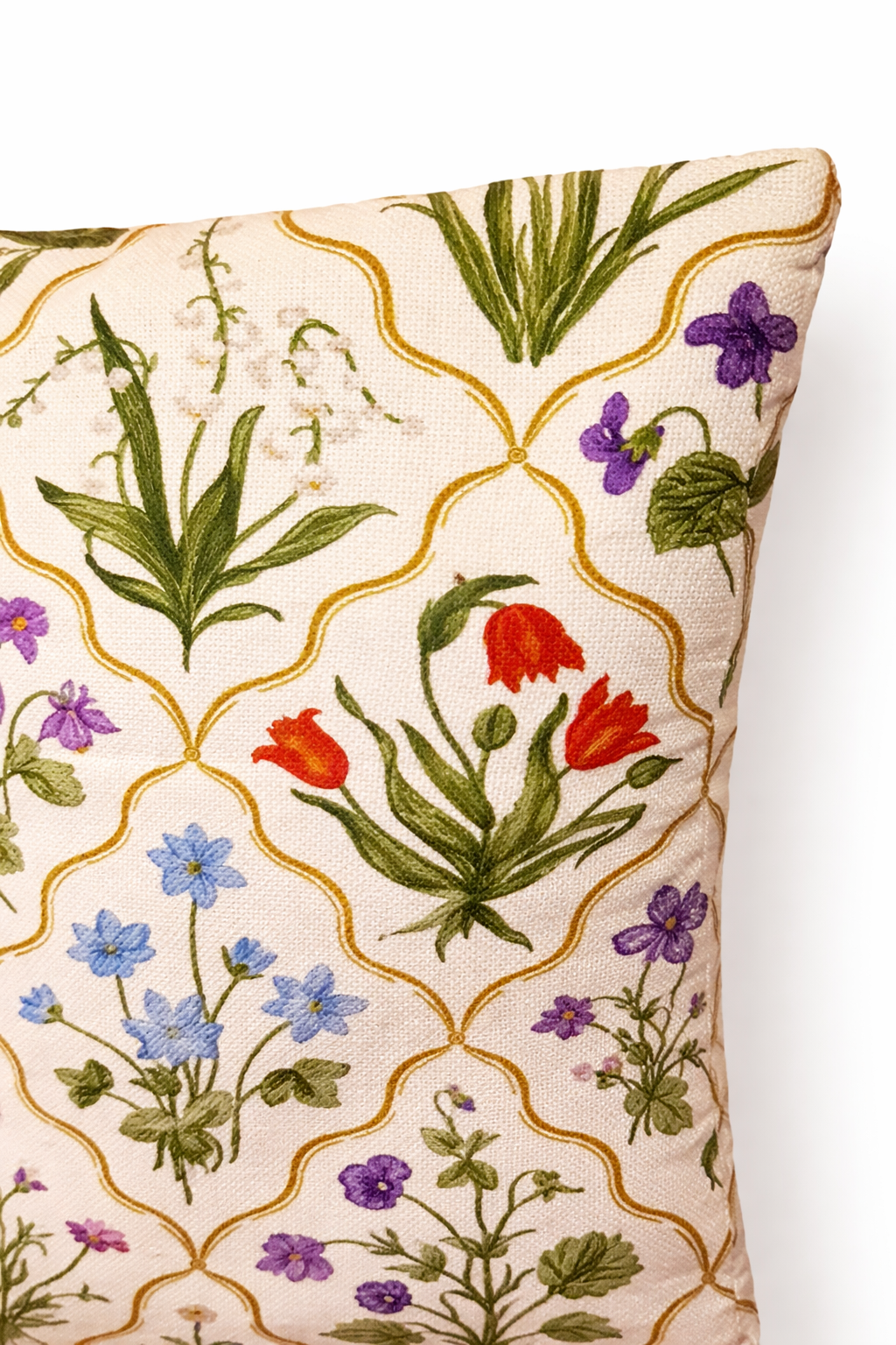 Cream square cushion with multicolour botanical flowers in a repeating trellis lattice pattern