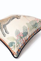Beige velvet cushion cover with reclining cheetah and botanical floral illustration