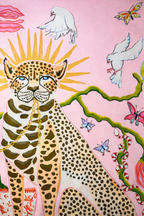 Pink velvet cushion cover with two illustrated cheetahs, sunburst halos, birds, floral branches and brown tassel corners