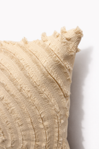 Ivory square cushion with concentric circular design appliqué and layered stitched pattern