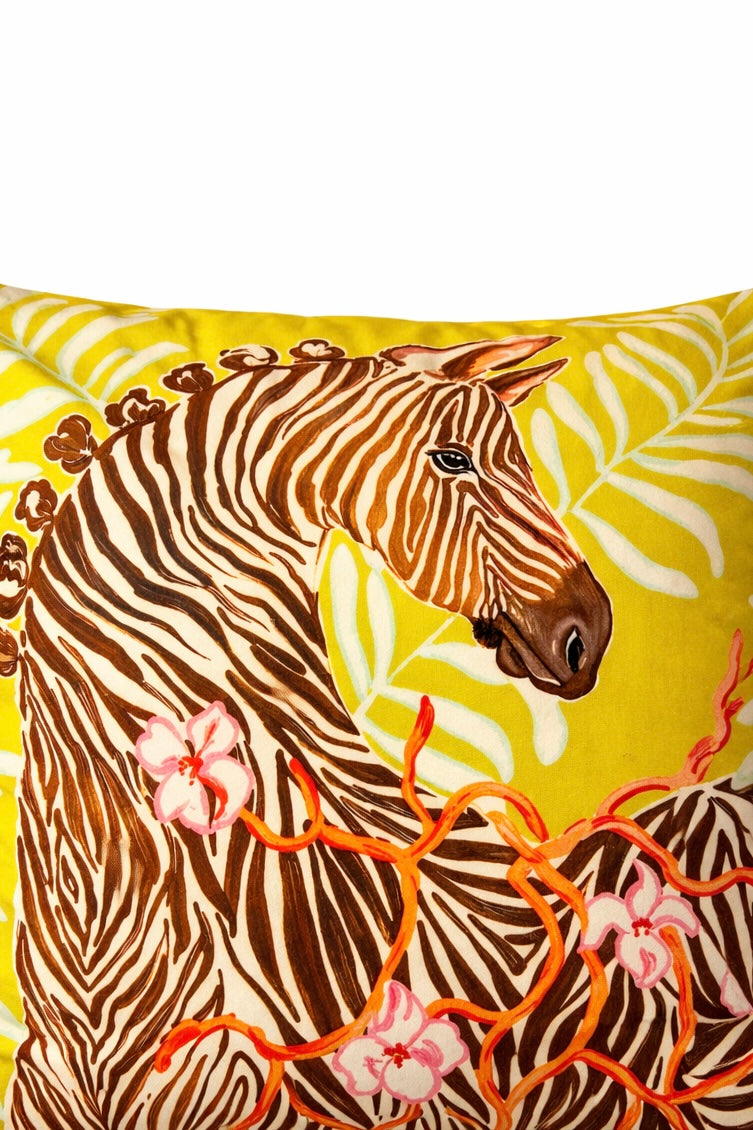 Yellow velvet cushion cover with illustrated zebra, floral branches, snake motif and pink corner tassels