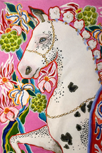 Pink velvet cushion cover with illustrated horse, floral motifs and white corner tassels