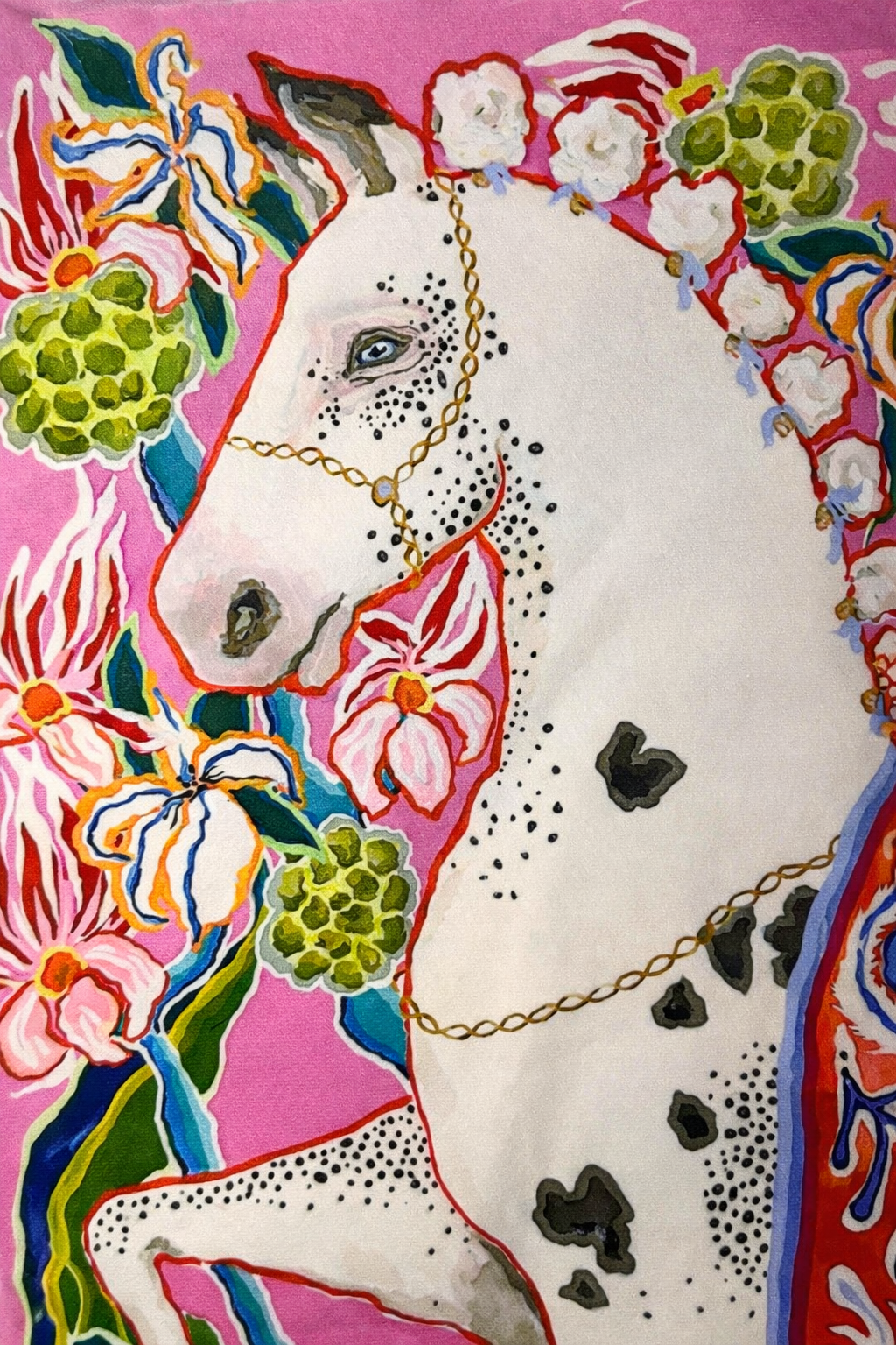 Pink velvet cushion cover with illustrated horse, floral motifs and white corner tassels
