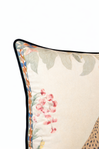 Beige velvet cushion cover with reclining cheetah and botanical floral illustration
