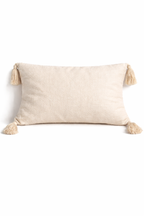 Beige rectangular cushion with diamond tufted detailing and tassel corners