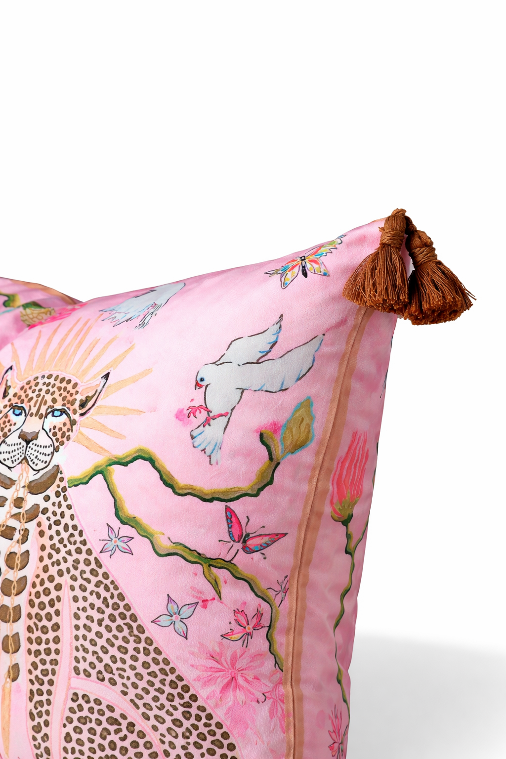 Pink velvet cushion cover with two illustrated cheetahs, sunburst halos, birds, floral branches and brown tassel corners