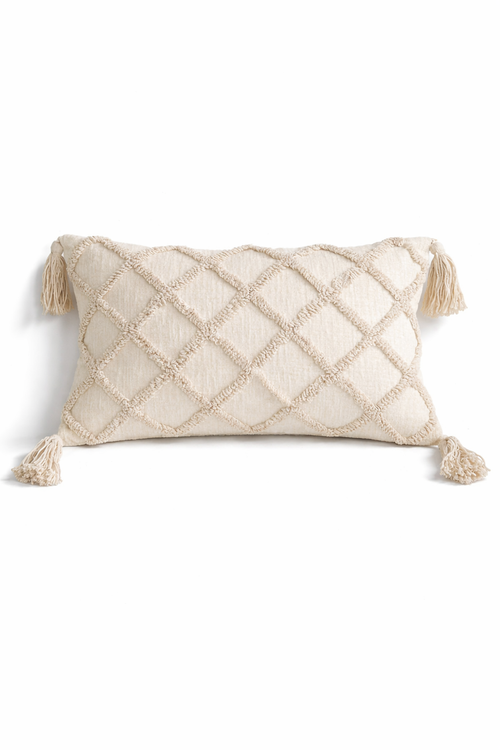 Beige rectangular cushion with diamond tufted detailing and tassel corners