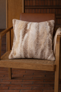 Beige faux shearling cushion with soft striped texture