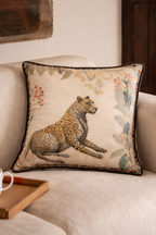 Beige velvet cushion cover with reclining cheetah and botanical floral illustration