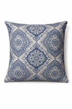 Blue and ivory square cushion with a repeating ornamental medallion pattern