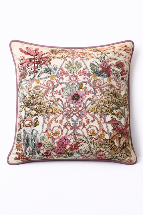 Square blush pink and cream velvet cushion cover with botanical and animal print, featuring elephants, swans and a tiger, finished with dusty pink piping.