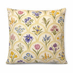 Cream square cushion with multicolour botanical flowers in a repeating scallop pattern
