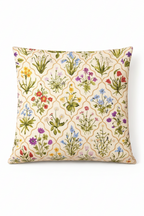 Cream square cushion with multicolour botanical flowers in a repeating trellis lattice pattern