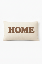 Ivory rectangular cushion with HOME appliqué lettering in raised stitched design