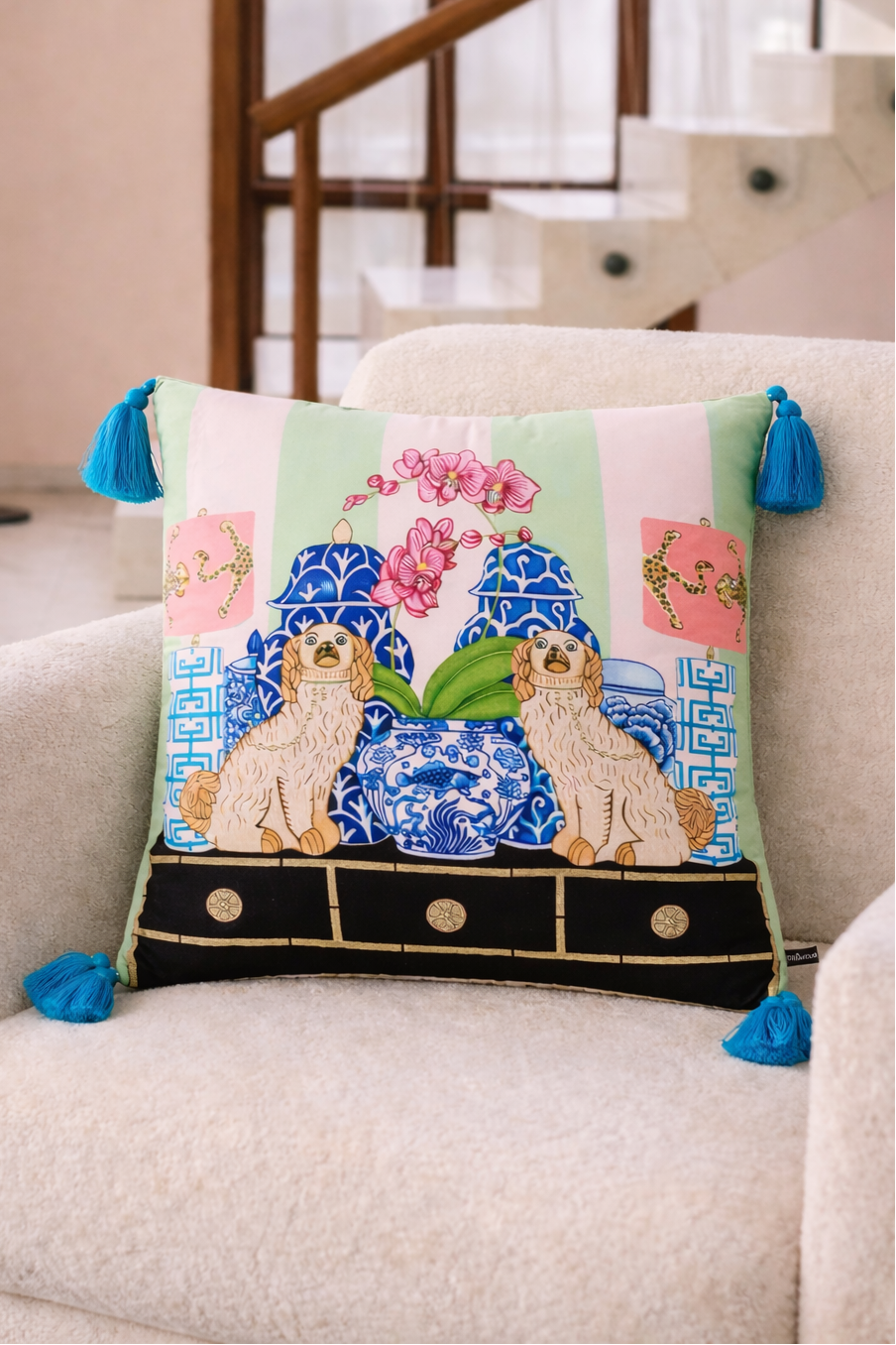 Mint green velvet cushion cover with two lucky dogs, blue porcelain vases and blue tassels