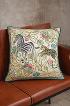 Mint green velvet cushion cover with zebra and leopard among botanical flowers