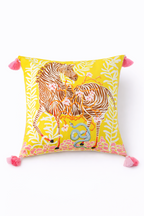 Yellow velvet cushion cover with illustrated zebra, floral branches, snake motif and pink corner tassels